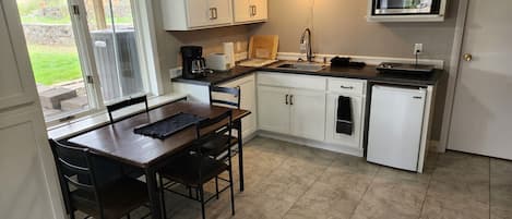 Kitchen/dining room. The table easily slides out when eating.