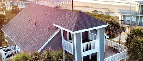 Our home is steps away from the beach with an expansive wraparound deck.