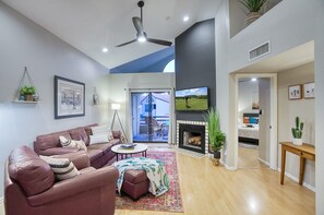 High ceilings and beautiful natural light in the open living room 