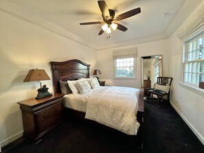 Large bedroom with lots of sunlight and ocean views 