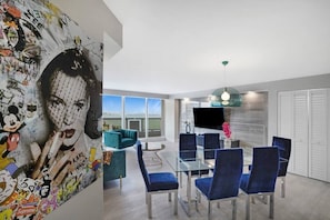 living room, Roku tv, dining area, balcony access