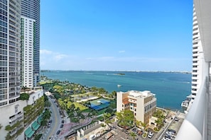 Furnished balcony with water views of Biscayne Bay and Margaret Pace Park