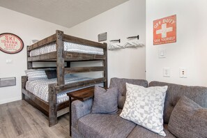 The Mason at Stillwater 3072:  Bunk Bed and Sofa with balcony: "Cozy space for lounging and enjoying the fresh air."