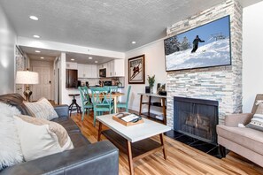 Vacation Rentals in Park City at New Claim 402: Living room with gas fireplace and private balcony