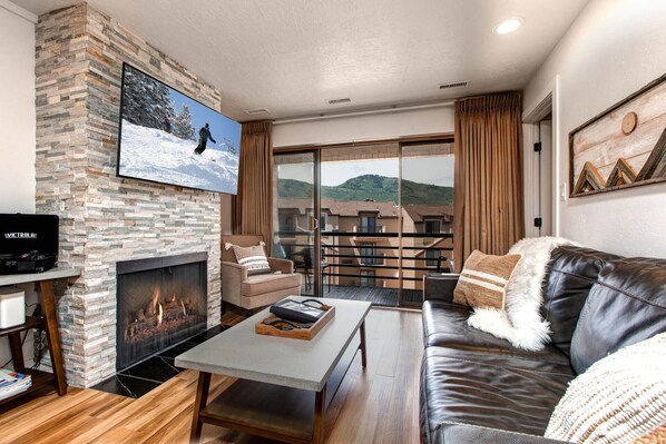 Vacation Rentals in Park City at New Claim 402: Living room with gas fireplace and private balcony