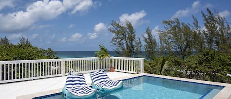 Come and Go Villa's ocean-view infinity pool with sweeping views of the Atlantic Ocean.  Come and Go Beach is steps from the house.