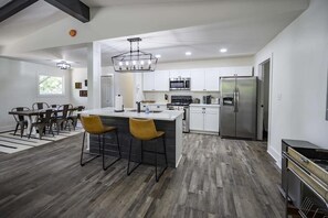 The fully equipped kitchen boasts sleek countertops, state-of-the-art appliances, and all the essentials you need to whip up delicious farm-to-table meals.