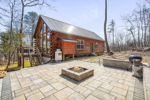 New fire pit patio area! Seating and charcoal grill available as well.