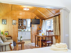 Living area | Woodcarver’s Cottage, Spring Village