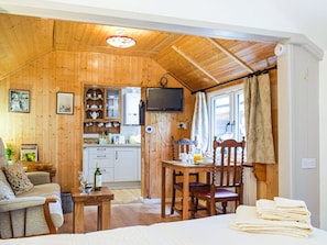 Living area | Woodcarver’s Cottage, Spring Village