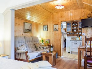 Living area | Woodcarver’s Cottage, Spring Village