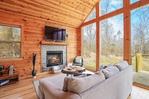Watch TV or turn on the gas fireplace and enjoy looking out at nature.