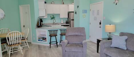 Living room, dining area and kitchen.