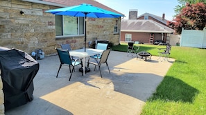 Enjoy evenings with a BBQ, patio set, and fire pit. 