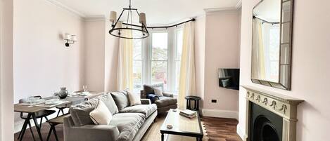 Living Room with Smart TV and Dining Table (1)
