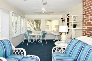 Enjoy afternoons and evenings on the front enclosed porch