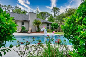 Relax and read a book in the day bed by the pool!