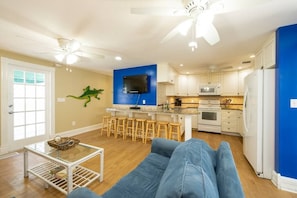 This living space is perfect for sleeping 2 guests, making a drink, and watching tv.