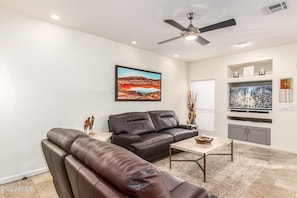 Family room with flatscreen TV & reclining sofa/love