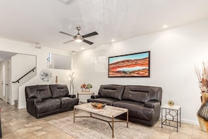 Family room with flatscreen TV & reclining sofa/love