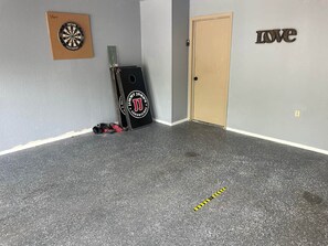 Darts and Cornhole in the Garage