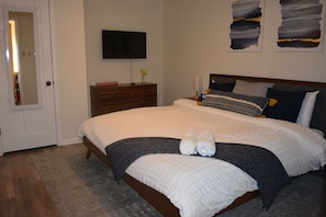 Master bedroom with king size bed and 40" Smart TV (includes Netflix).