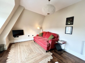 Living Area with Double Sofa Bed and Smart TV (2)