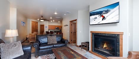 Main Living Space, Dining and Kitchen with TV, Gas Fireplace and Deck