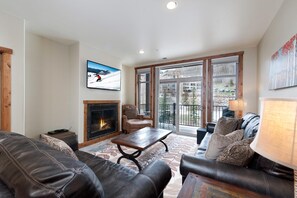 Main Living Space with TV, Gas Fireplace and Deck