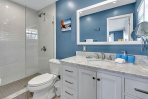 Master ensuite features a wide frameless shower