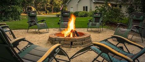 North side view of property.  Outdoor Fire Pit (Hard Wood provided by owner)