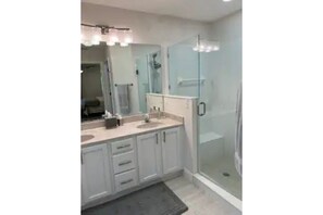 Main Bathroom with shower and separate toilet closet.