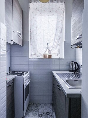 Fully equipped kitchenette with microwave and kettle.