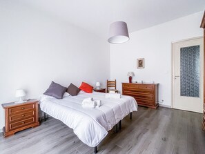 Bedroom with double bed, large wardrobe and balcony