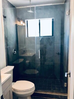 Bath with rain shower.