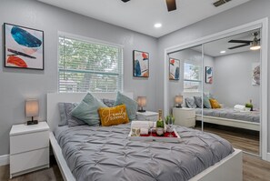 Elegant bedroom with queen size bed, smart TV and full sized mirror closet. Enjoy the comfort while staying at your home far from home. Do you love what you see? Don't think twice and send us an inquiry as soon as possible!