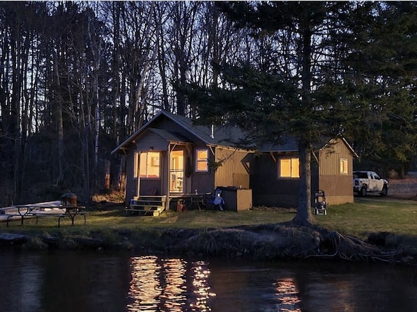 Cabin at night from the lake 