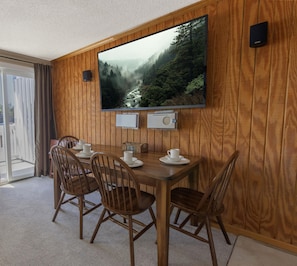 The table for four with the large 60" TV above.
