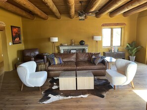 Comfortable living room with local Taos art.
