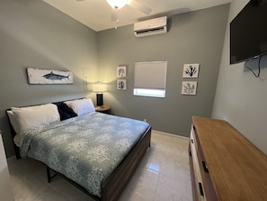 Front Queen Bedroom with Dresser and Smart TV, Across from Back Bathroom 