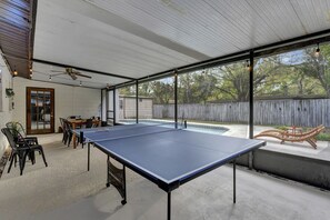 Well Lit Outdoor Lounge Area with Full Size Ping Pong Table
