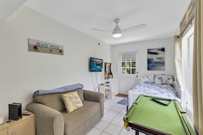 Playroom with three single beds.