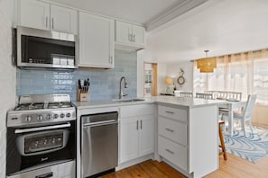 Open Kitchen with Quartz Counters and new stainless appliances