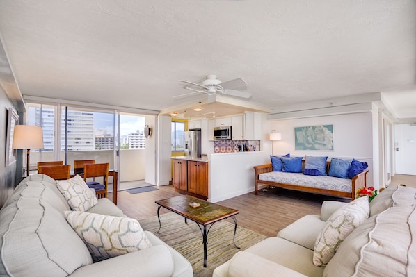 Floor to ceiling sliding windows on both sides. Sofa bed sleeps extra two guests