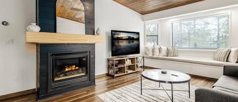 Living room with fireplace & smart TV