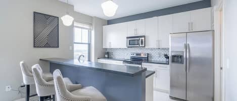 The kitchen area that is open to the main living area.