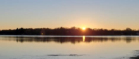 Photo of sunset from the front steps of the cabin.