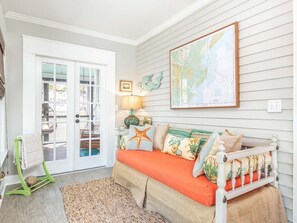 Sun porch with daybed, perfect for a good book (or nap).