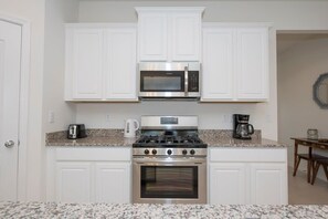 Fully equipped kitchen - Microwave, coffee maker, kettle, toaster and a gas stove.
