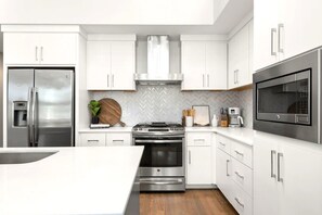 The gourmet kitchen offers a variety of appliances.